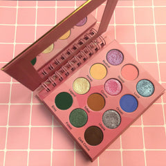 Lavish Beauty London eyeshadow palette with 12 vibrant shades in a sleek black compact, open to display colorful matte and shimmer pans