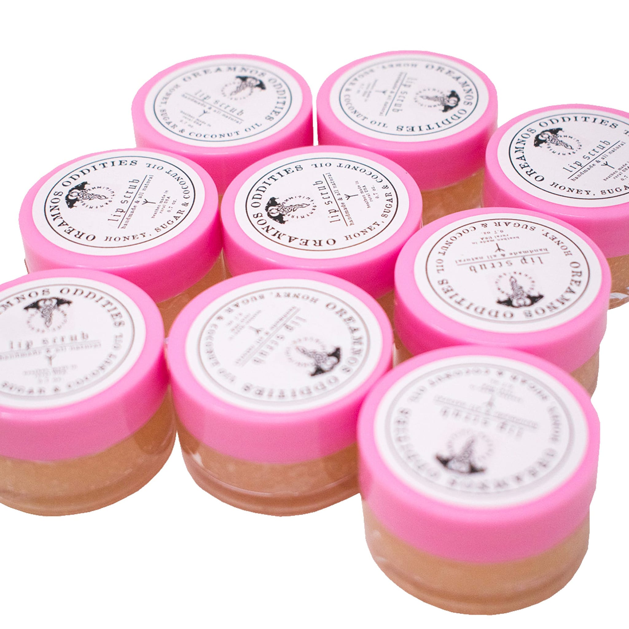 Eco-friendly glass jar of natural lip scrub with wooden scoop on marble surface