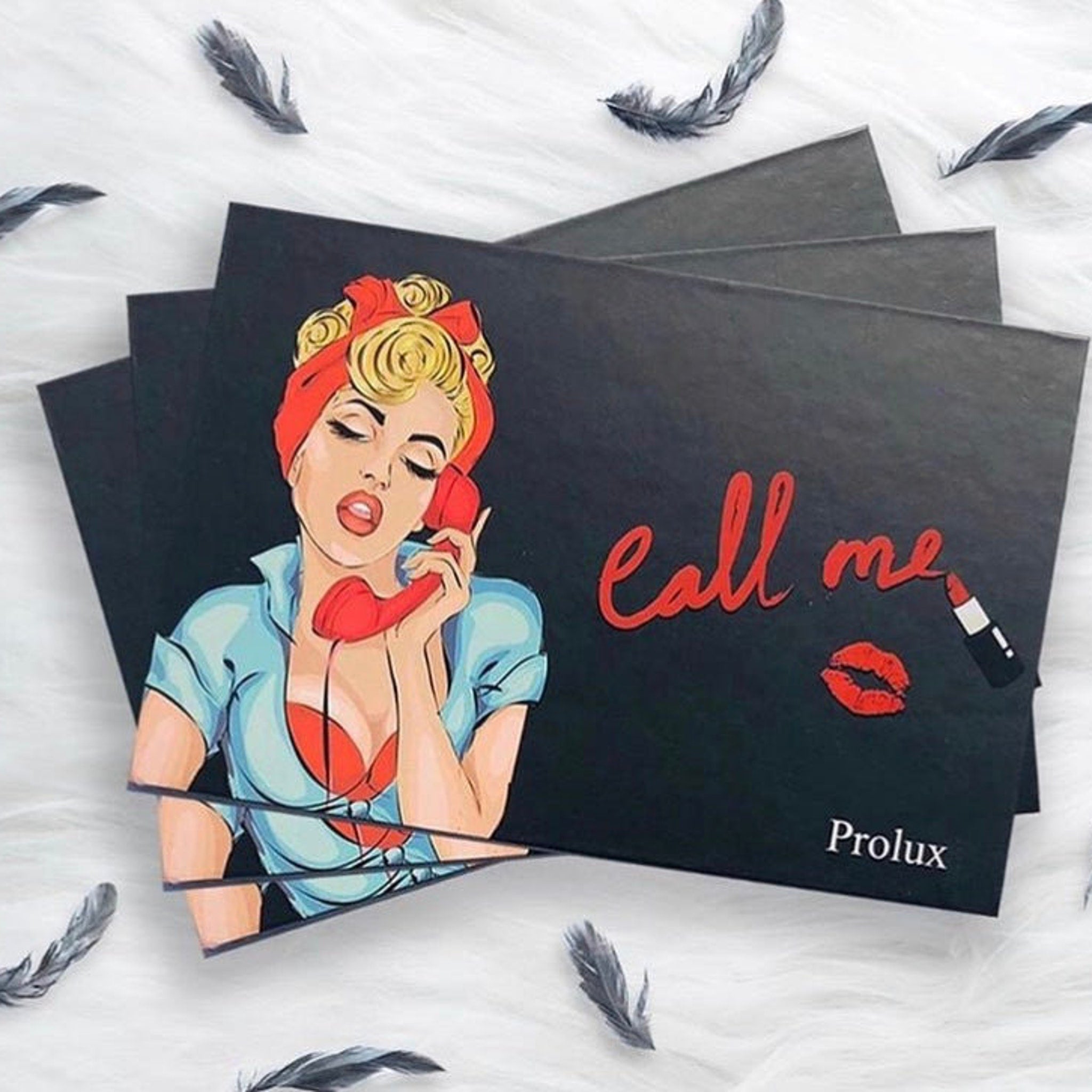Eyeshadow palette with black cover, Call Me text, and Prolux brand name