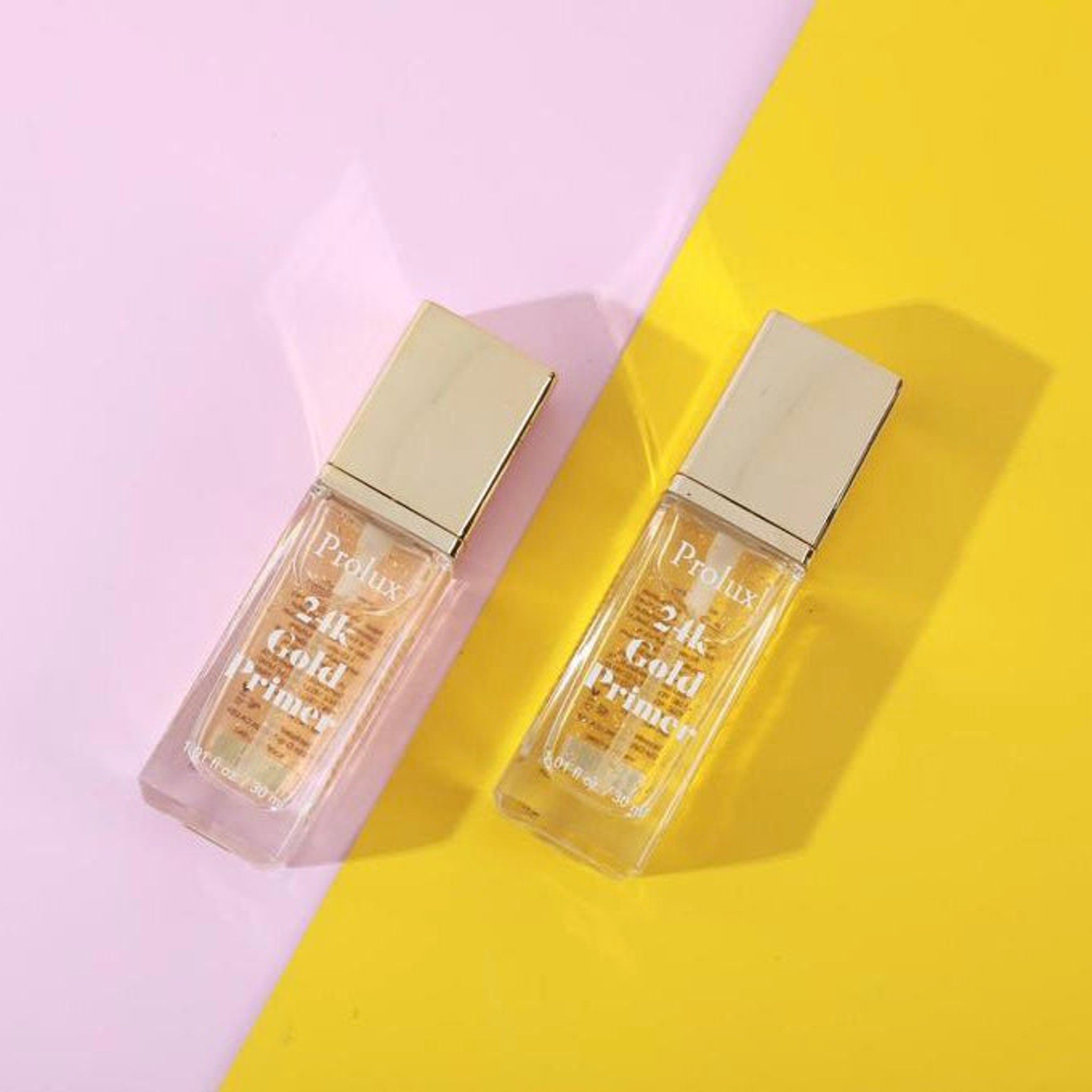 Primer bottles with gold liquid, gold cap, and Prolux brand text on yellow and pink background