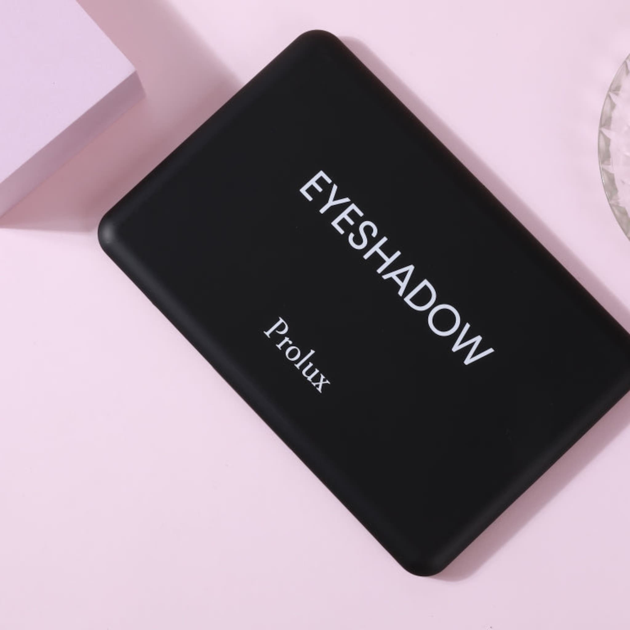 Eyeshadow palette, black rectangular case with white text, Prolux brand name visible