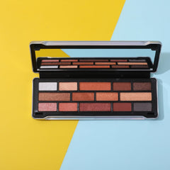 Eyeshadow palette with silver frame, black case, and various brown and neutral shades