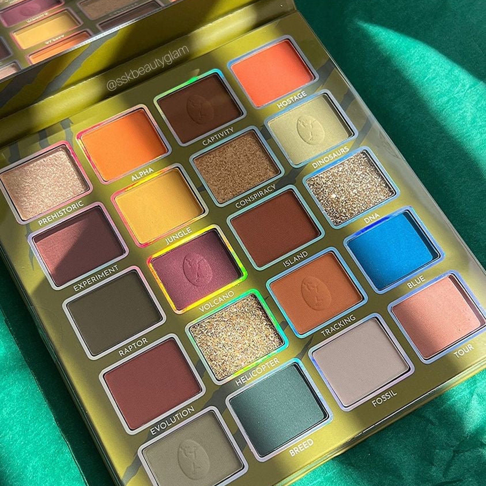 Eyeshadow palette with multiple colors, including orange, brown, and blue, with @sskbeautyglam text visible