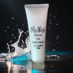 Close-up of polymorph formula cream in sleek white tube with gold accents, showcasing rich texture and matte finish