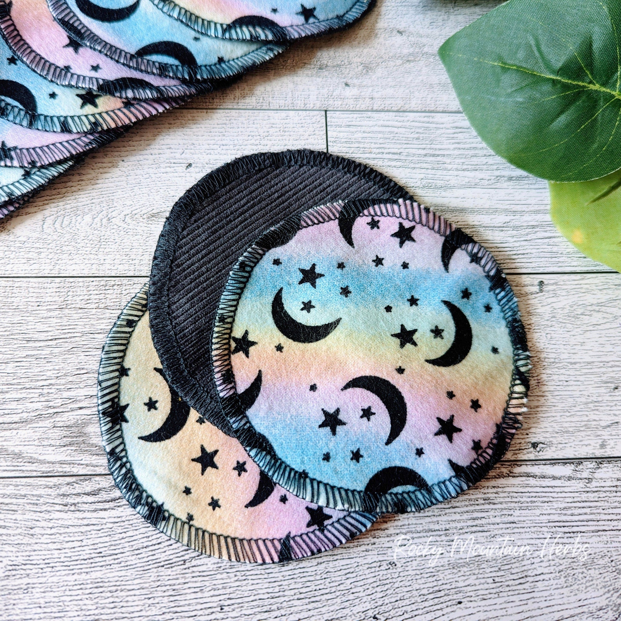 Cotton facial rounds with moon and star pattern, black trim, and colorful fabric