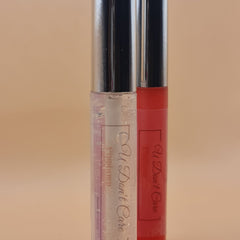 Lip gloss tubes with silver cap, clear and red liquid, "U Don't Care" text