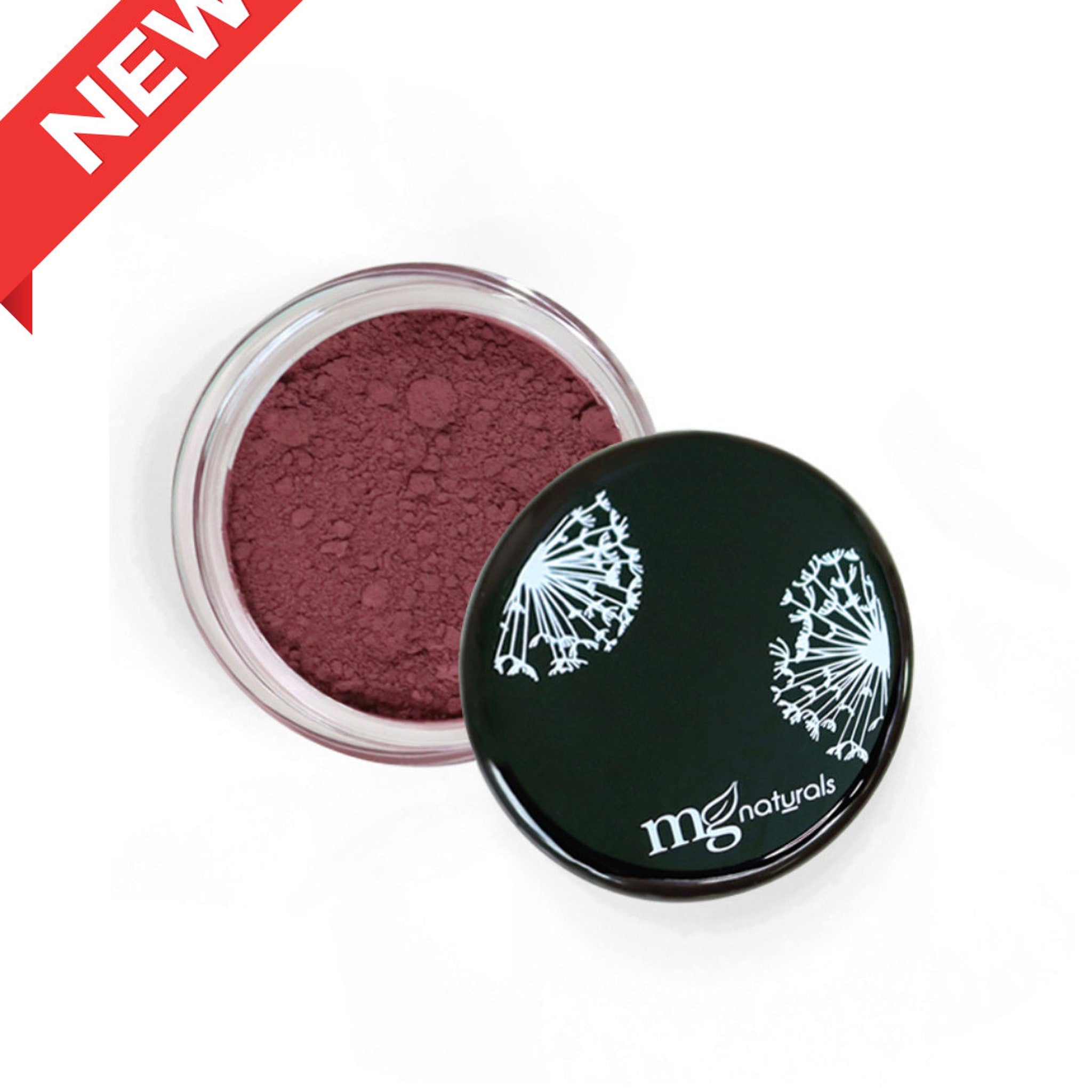 Side view of vegan mineral eyeshadow pan showing pressed powder texture in natural earthy tones