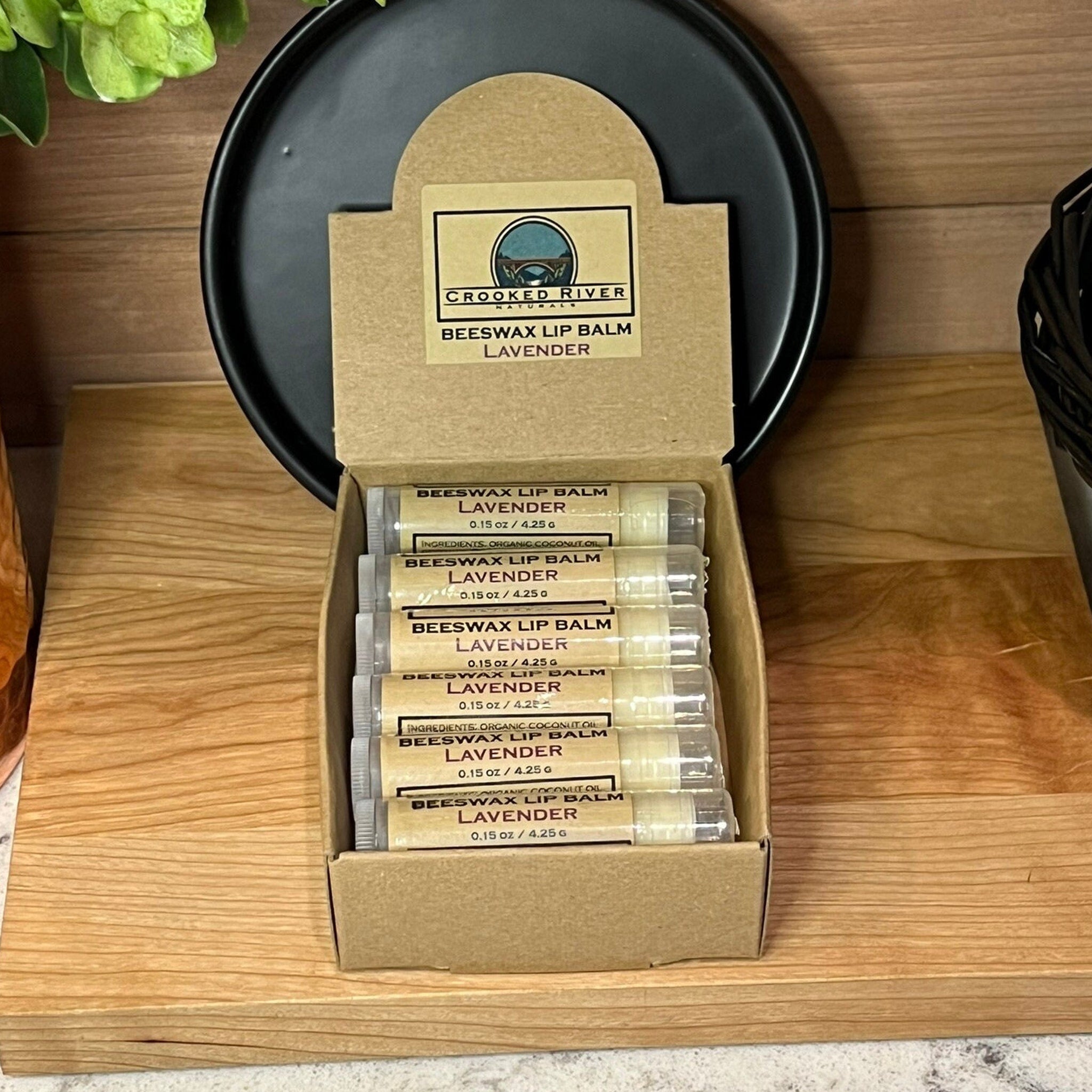 Beeswax lip balm tubes in cardboard box, Crooked River Naturals label, lavender flavor