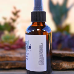 Toner bottle brown glass with black cap and white label, Mui Care brand visible