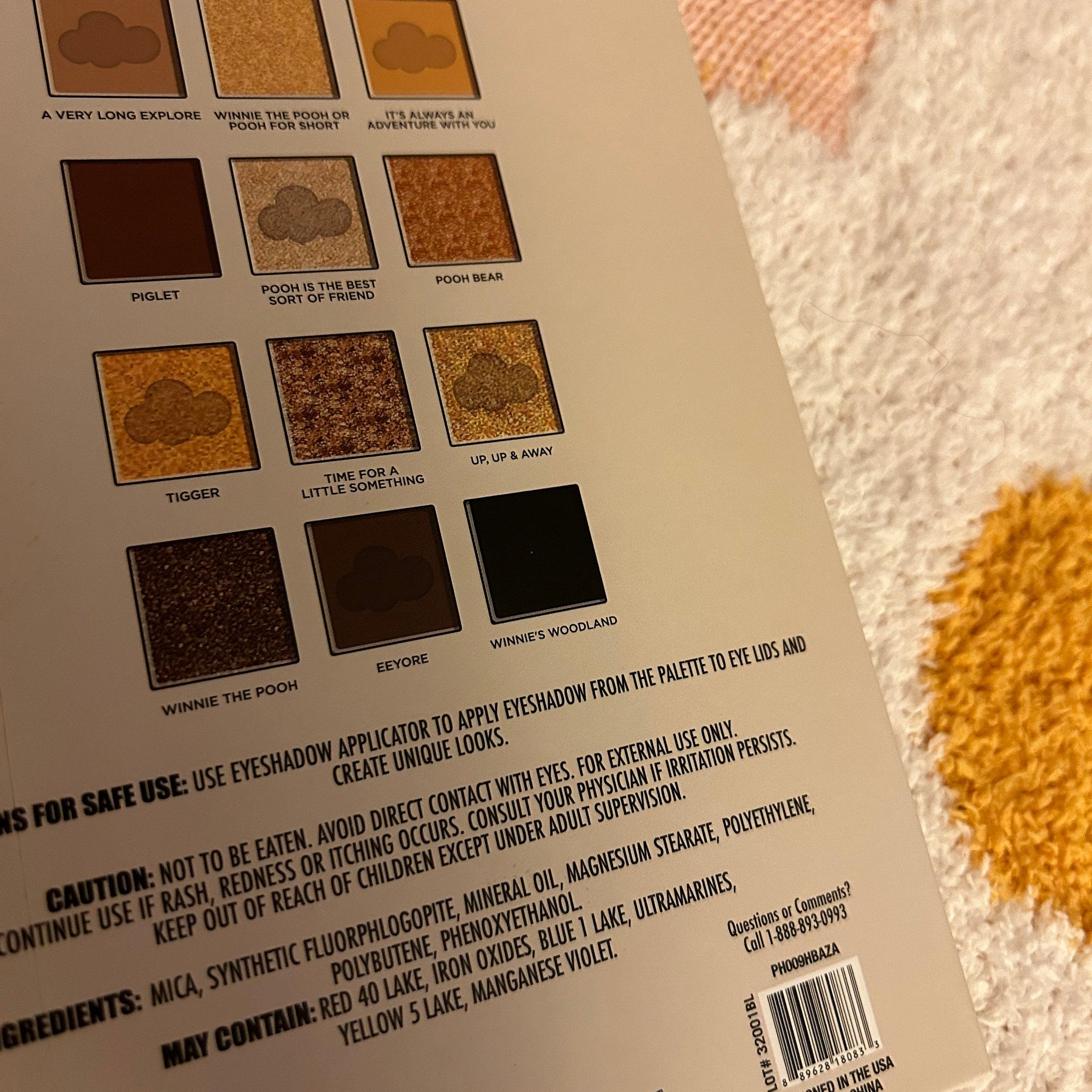 Close-up of Winnie the Pooh eyeshadow palette showing honeycomb imprint on matte brown shade