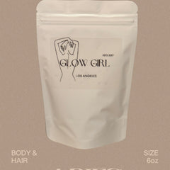 Face powder in white pouch with "GLOW GIRL" text and 6oz size