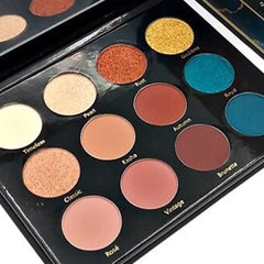 Day & Night Eyeshadow Palette featuring 12 vibrant matte and shimmer shades in a sleek black compact