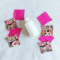 Makeup remover pads, pink fabric and paisley pattern, with bottle of liquid