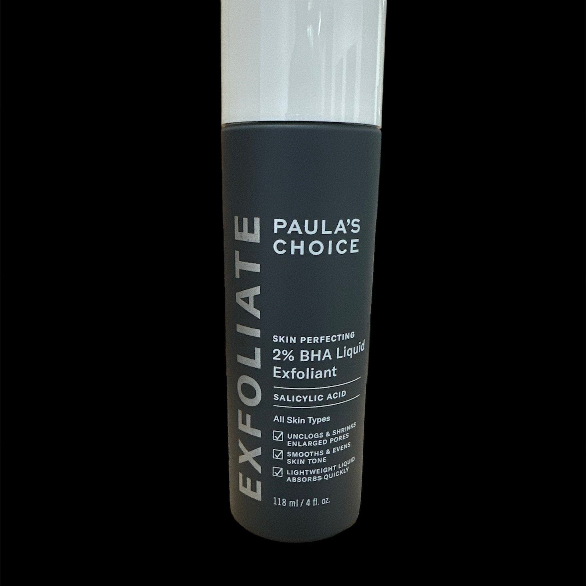 Exfoliant skincare product, dark gray bottle with white cap, Paula's Choice brand name visible