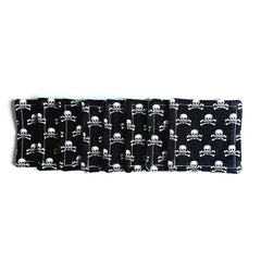 Coasters black fabric with white skull pattern, stacked together