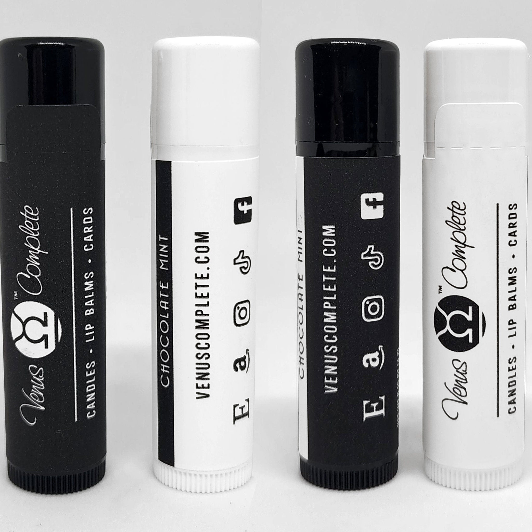 Lip balms with black and white tubes, Venus Complete branding, and social media icons