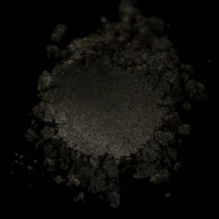 Close-up of pressed taupe eye shadow with shimmer finish in compact pan, showcasing cool neutral undertones