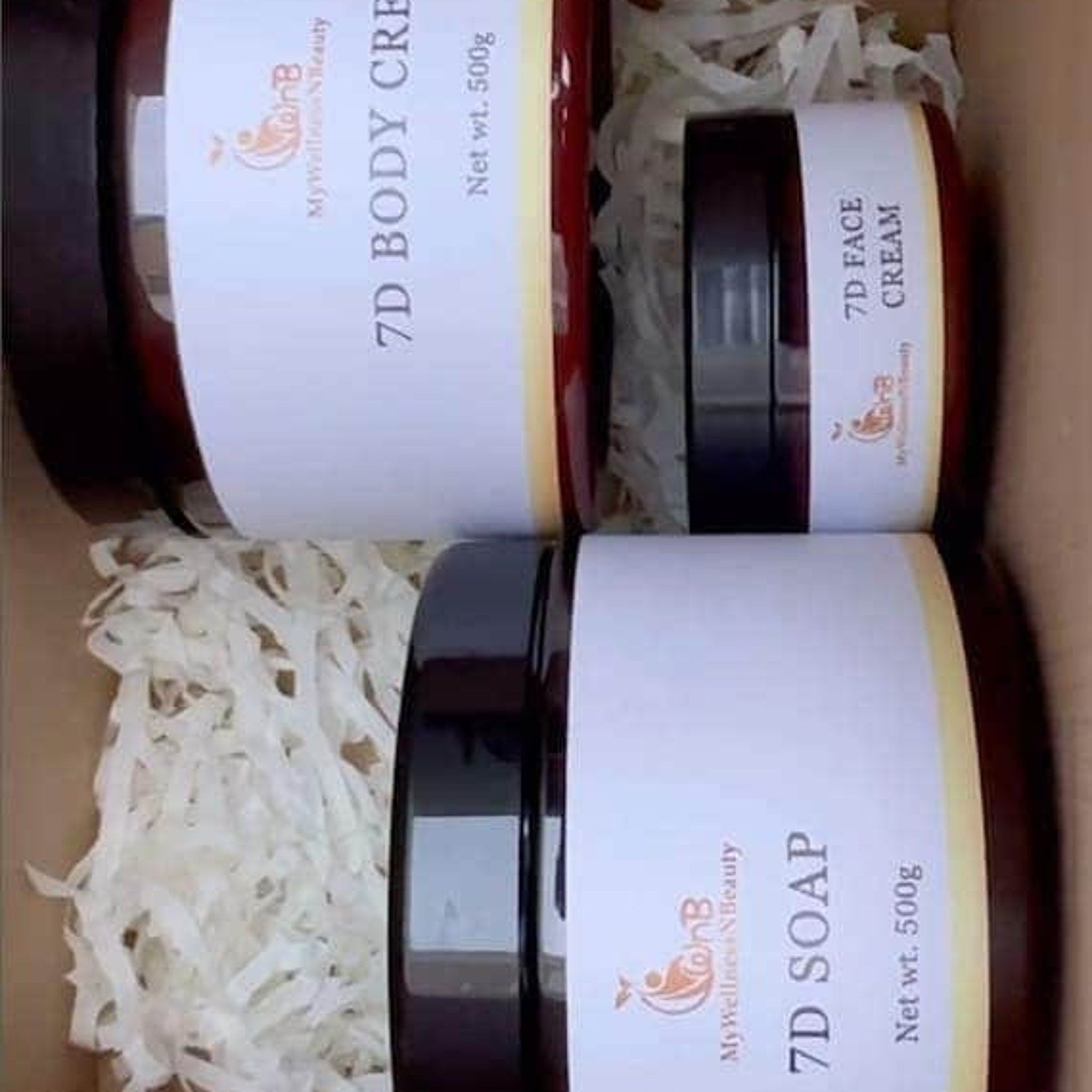 Close-up of rich white body cream with a velvety texture in a sleek gold-trimmed jar, showcasing luxurious hydration