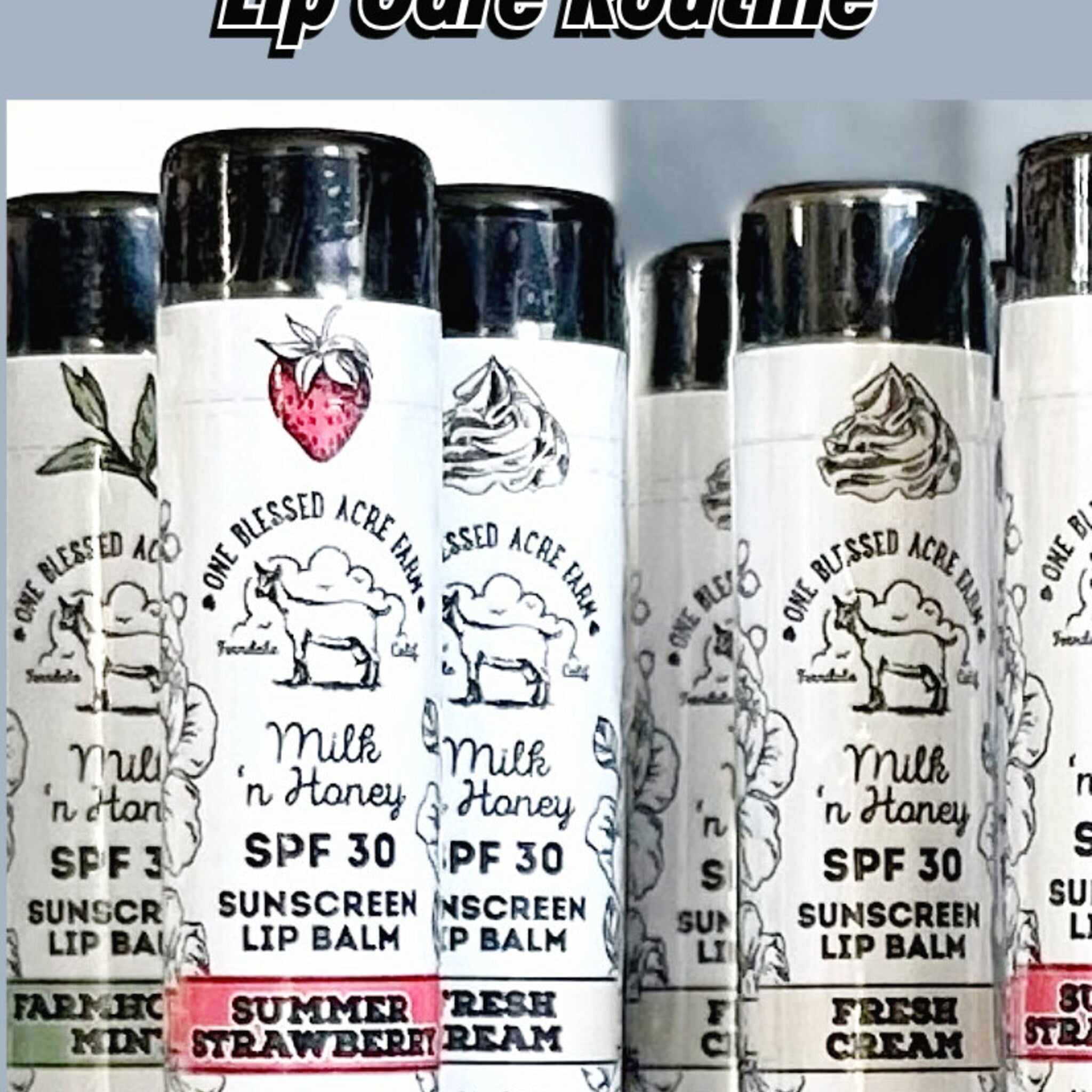 Sunscreen lip balm tubes with black caps, white labels, and "One Blessed Acre Farm" text and illustrations