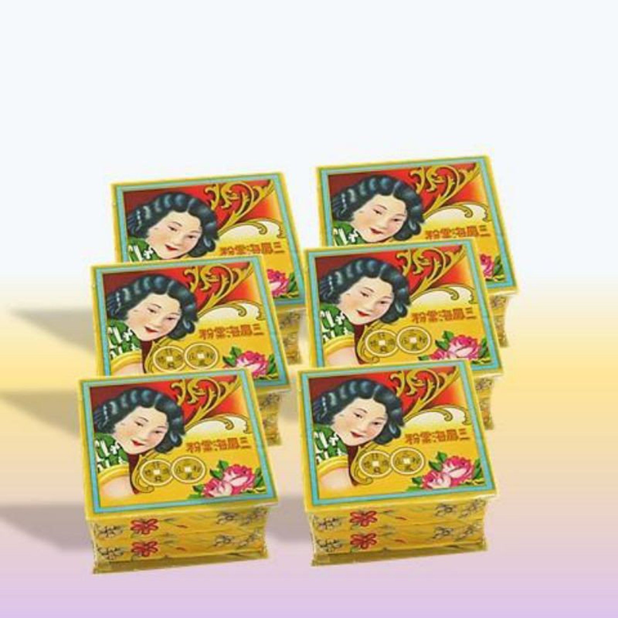 Boxes with yellow, red, and blue floral pattern and woman illustration, stacked together