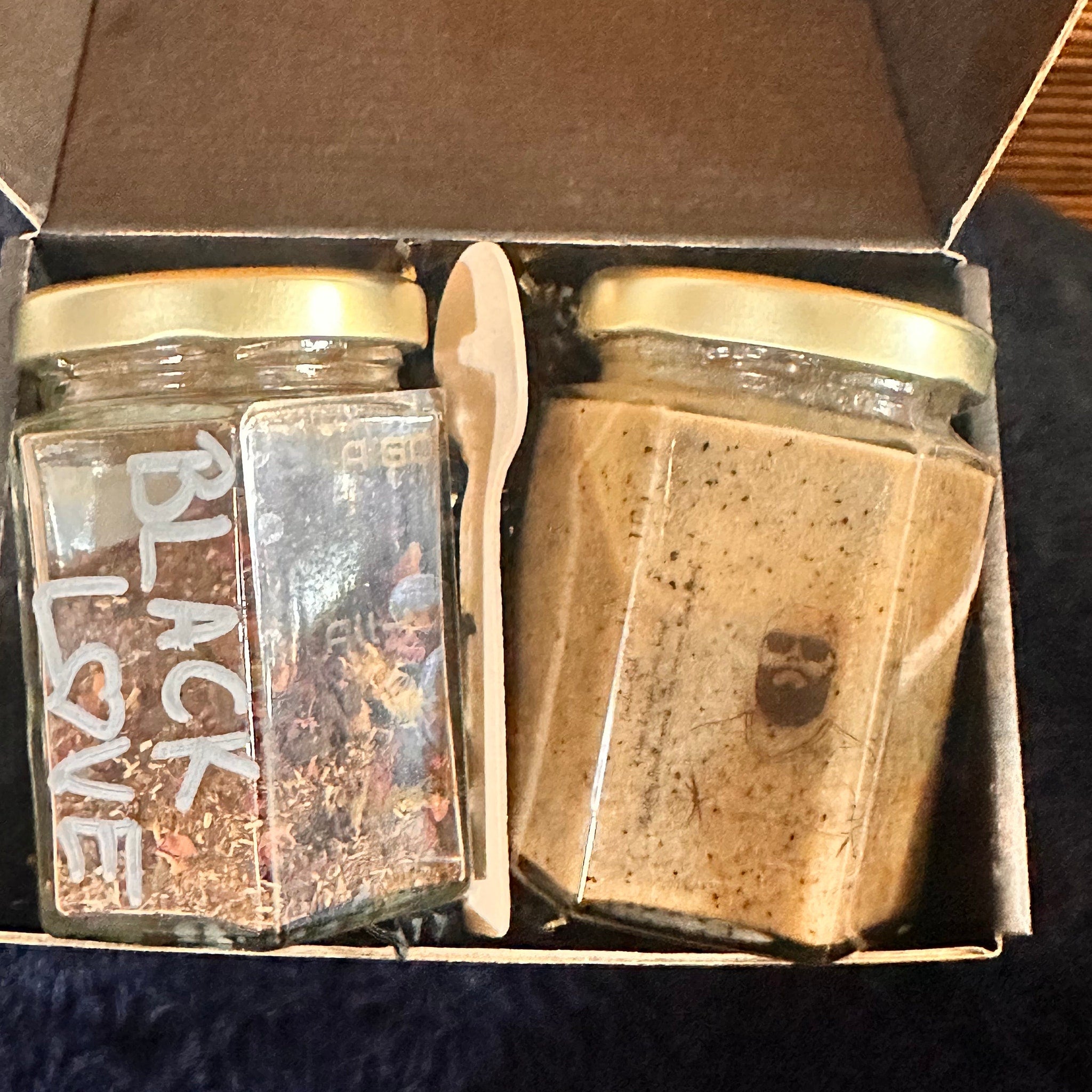 Glass jar set with gold lids, wooden spoon, and "BLACK LOVE" text in gift box