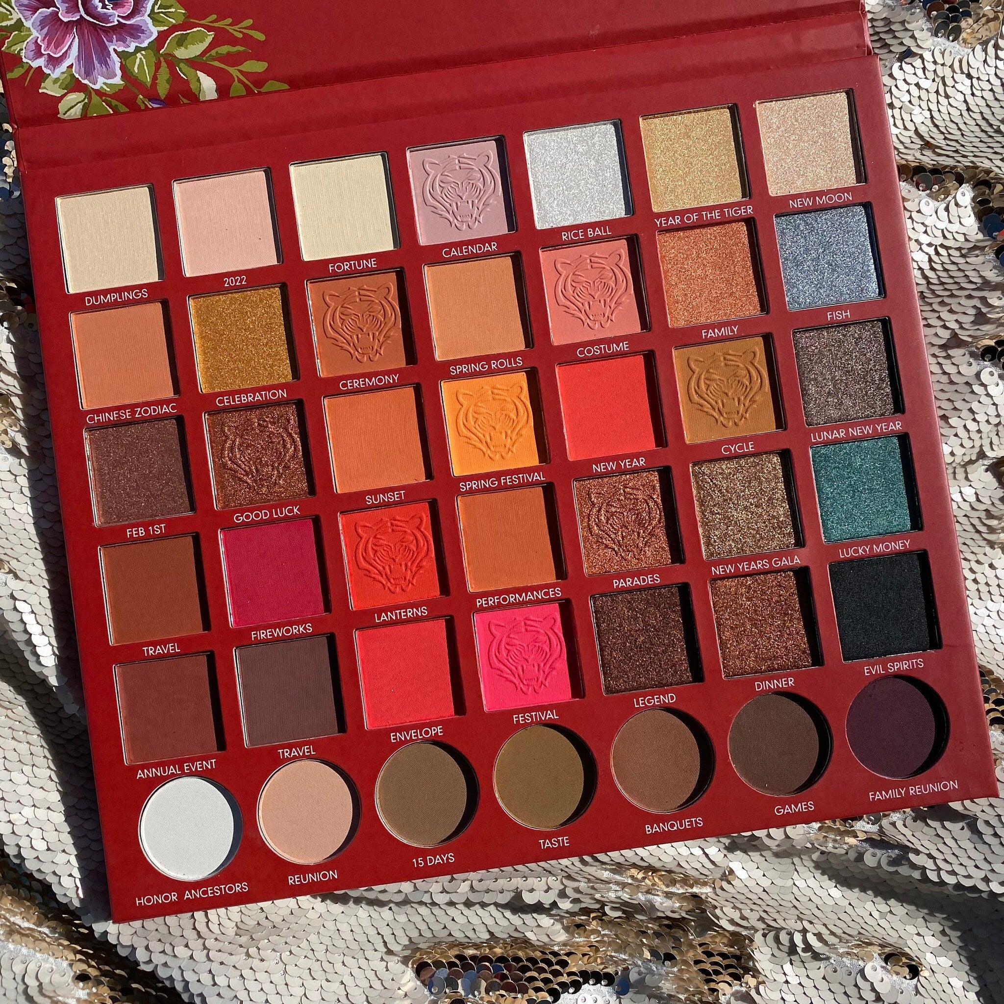 Eyeshadow palette with red, gold, and pink shades, Prolux brand, for eye makeup