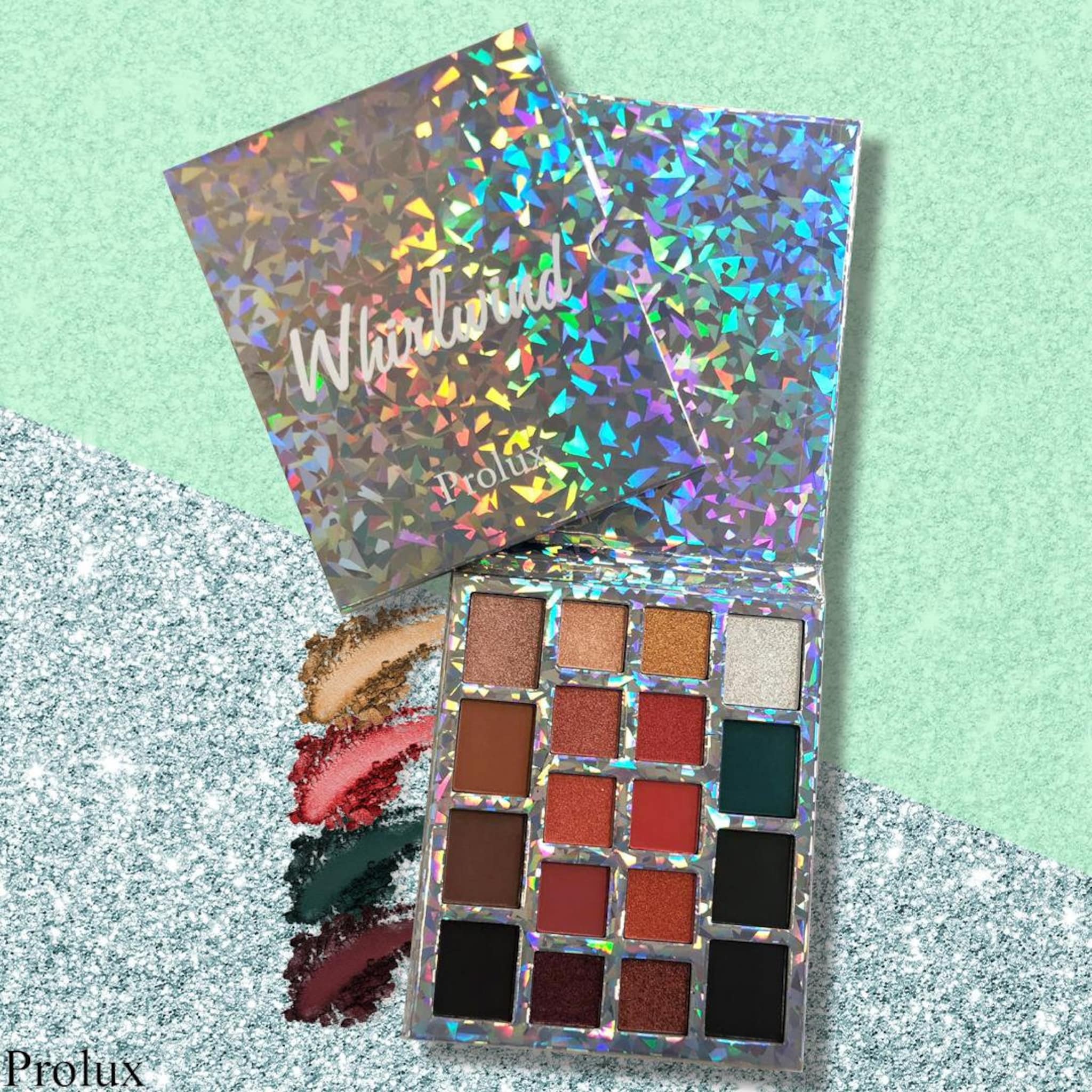 Eyeshadow palette with holographic cover, multiple colors, and Prolux branding.