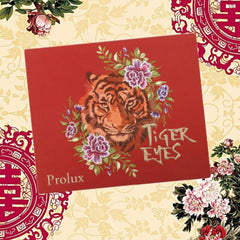 Red box with tiger illustration, floral design, and "Tiger Eyes" text by Prolux