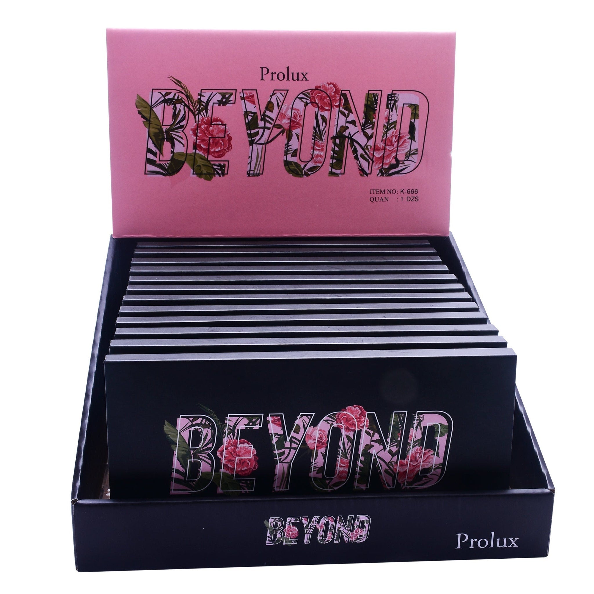Makeup display with pink and black floral Beyond text, Prolux brand visible, in a black display box