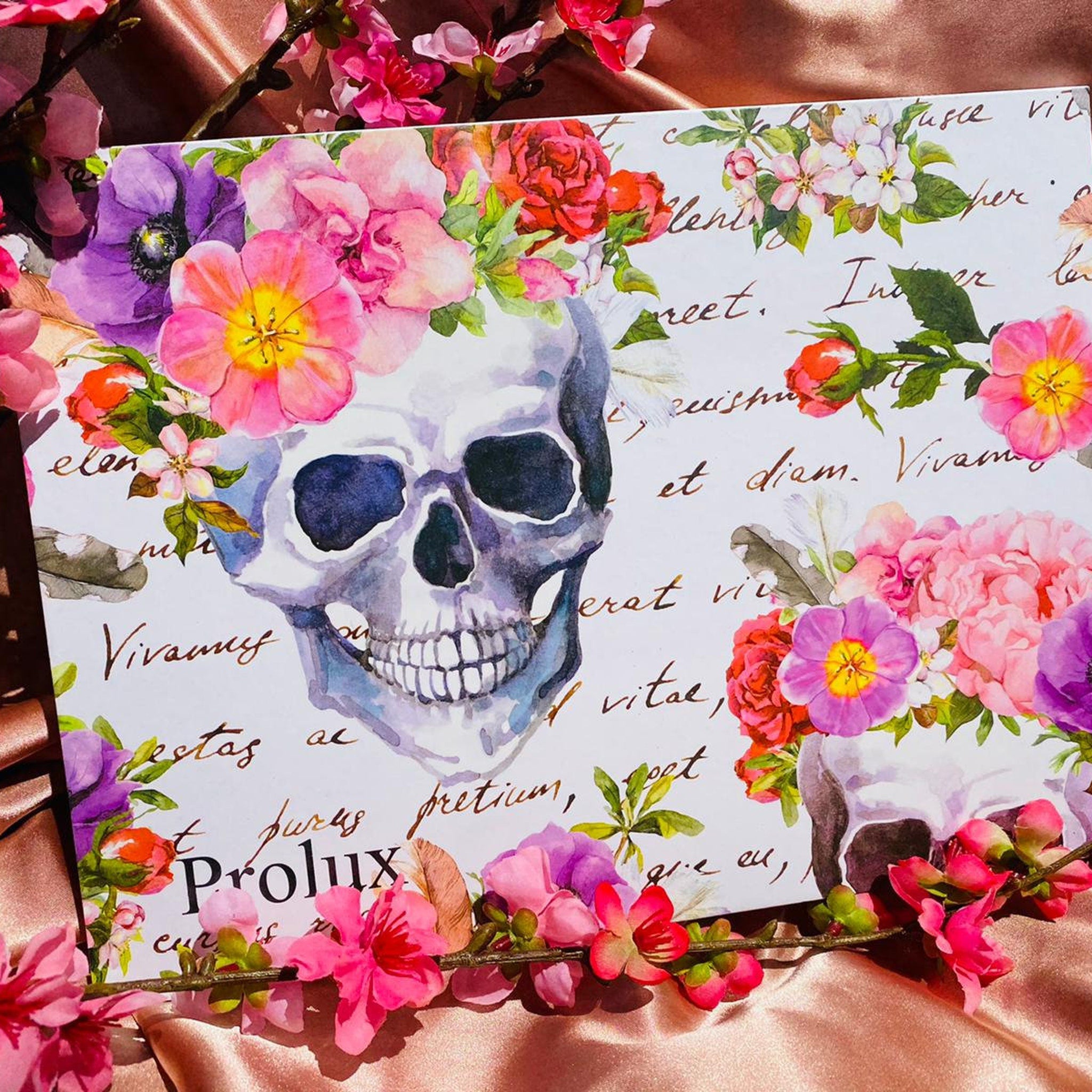 Skull art print with watercolor skull, floral design, and script text on white background