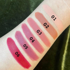 Close-up of PXLOOK lipstick bullet showing creamy satin finish in vibrant pink shade with gold-toned casing
