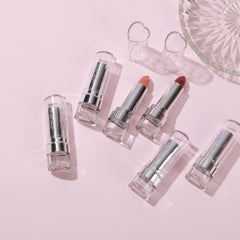 Side view of PXLOOK lipstick bullet showcasing creamy matte finish in bold red shade with gold-toned casing