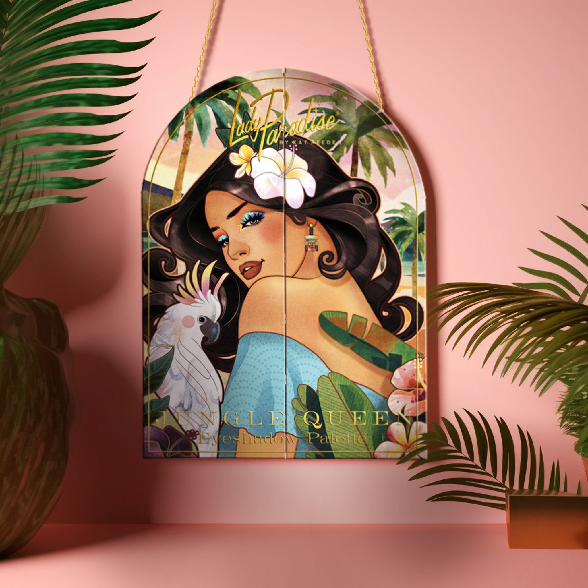 Side view of Jungle Queen eyeshadow palette showing 12 vibrant rainbow shades in tropical-inspired packaging