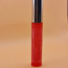 Lip gloss tube with red body, silver cap, and "U Don't Care" text label