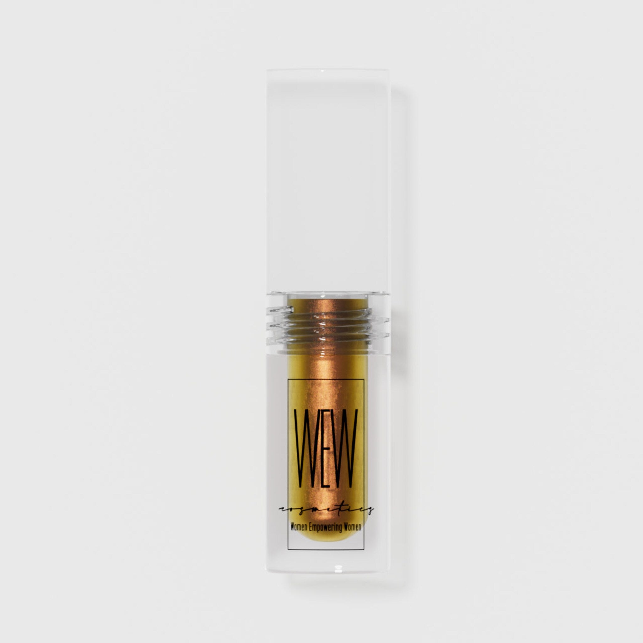 Close-up of a hand applying shimmering liquid eye shadow in emerald green with a doe-foot applicator