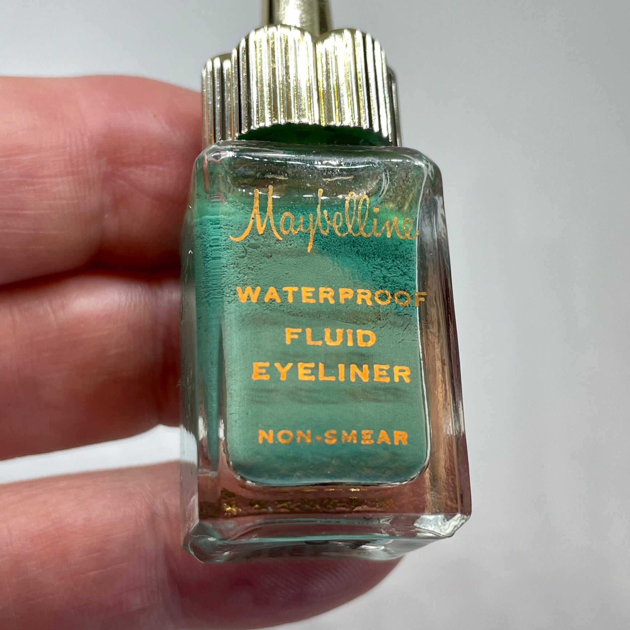 Packaging view of Vintage 1960 Maybelline Green Fluid Eyeliner - Unused Collectors Item in Glass B