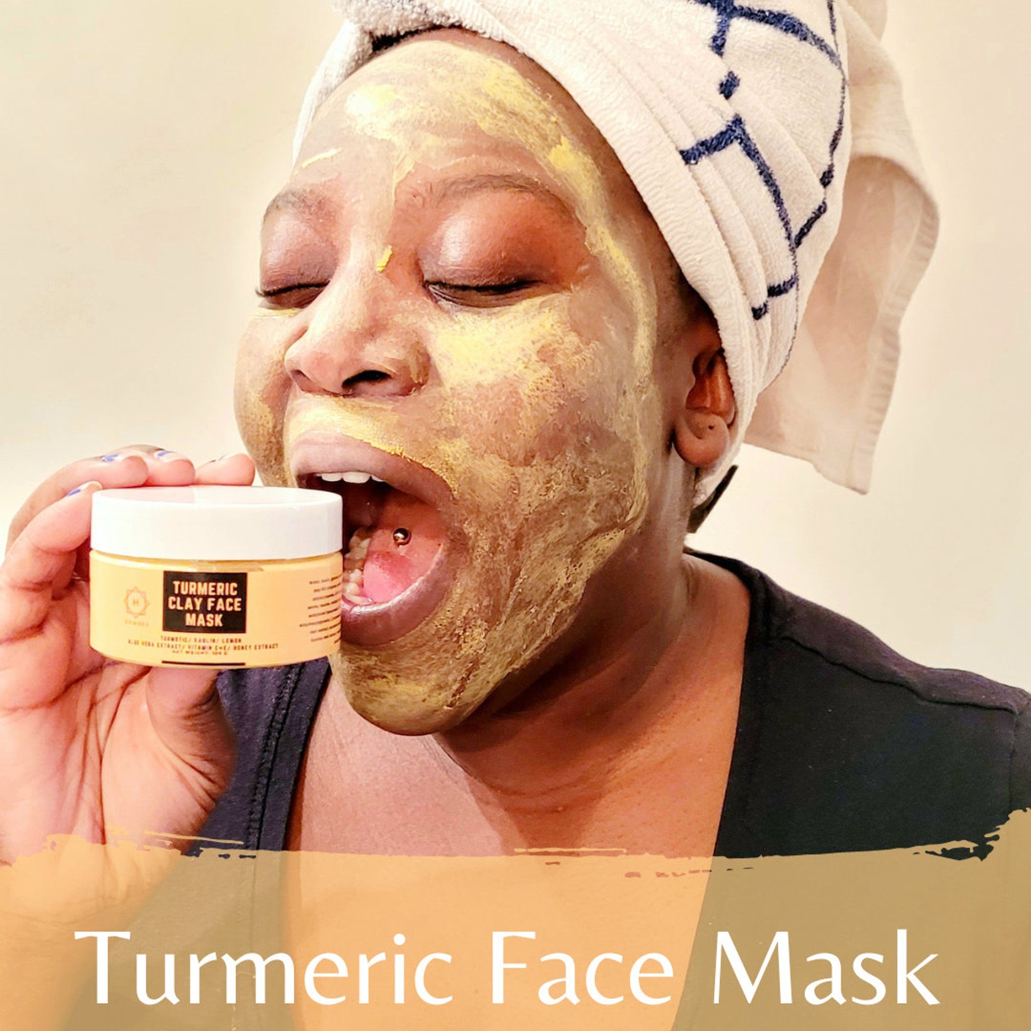 Close-up of golden turmeric clay mask in jar with natural texture and visible spice particles