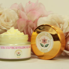 White jar of Revitalizing Ultra Sculpt Face Cream with gold lid and minimalist branding on sleek countertop