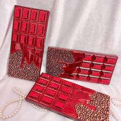 Chocolate Bar Eyeshadow Palette with shimmering gold packaging and assorted matte and glitter shades