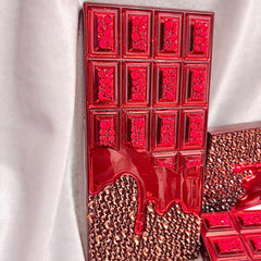 Close-up of shimmering bronze and gold eyeshadows in the Chocolate Bar palette with glitter particles