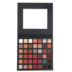 Open neutral eyeshadow palette displaying matte and shimmer shades in warm browns and creamy beiges