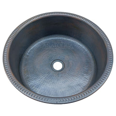 Copper sink with hammered finish, dark bronze color, and Anatolica brand text