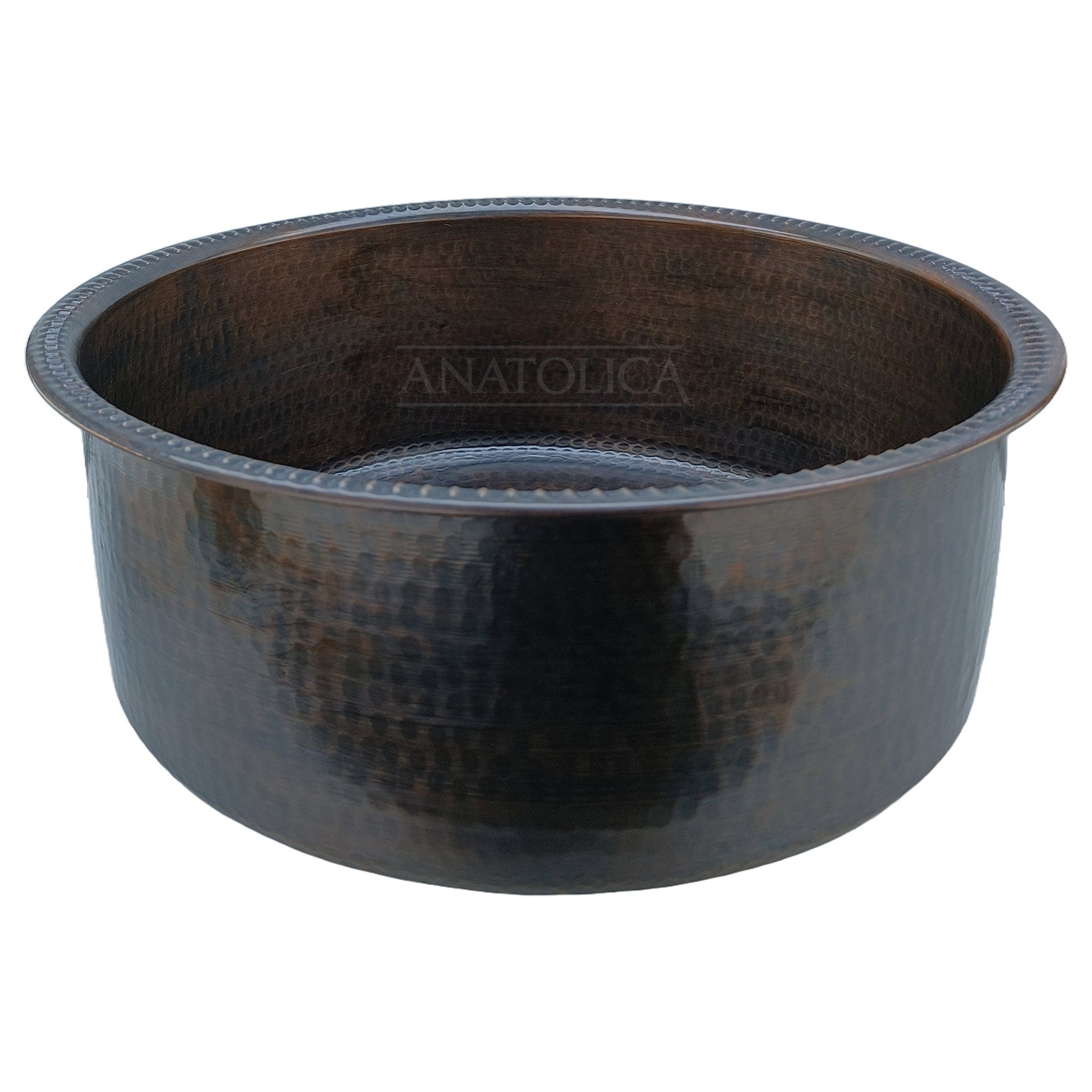 Copper sink with hammered finish, dark brown color, and Anatolica brand text visible