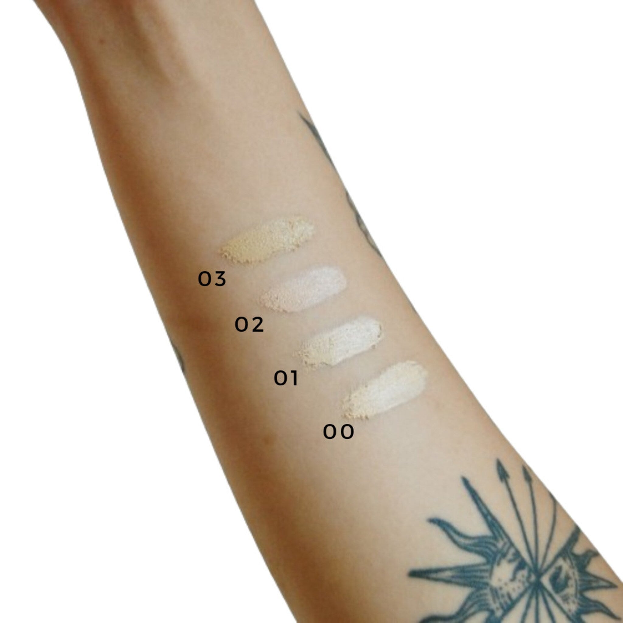 Vegan zero waste concealer palette showing refillable pan with built-in mirror and dual-ended brush