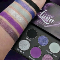 Luna Eyeshadow Palette featuring 12 vibrant matte and shimmer shades in sleek black compact with gold trim