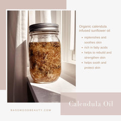 Calendula oil in a glass jar with brown flowers, clear liquid, and metal lid, Basswood Beauty visible