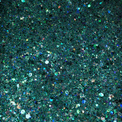 Close-up of vibrant turquoise eyeshadow with sparkling silver glitter particles in compact pan