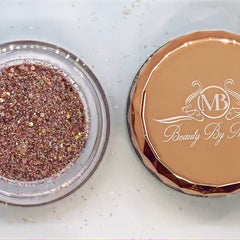 Side view of rose gold glitter eyeshadow palette showing shimmer texture and compact size