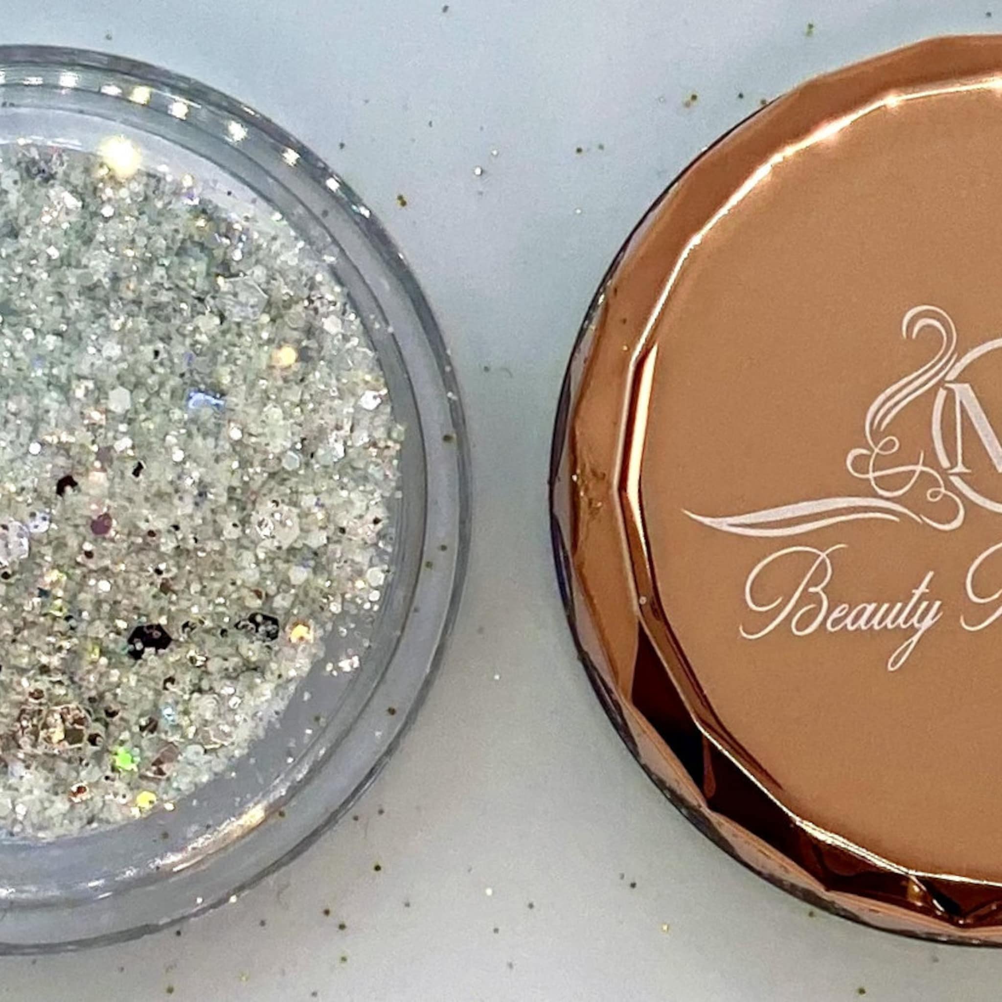 Glitter jar with silver glitter, gold cap, and Beauty Secrets branding