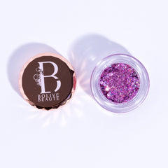 Pink and purple glitter eyeshadow palette with shimmering metallic finish in compact case